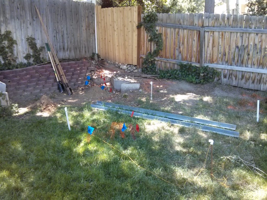 I placed rebar in the ground to measure out where I wanted my poles. PVC pipe from previous irrigation projects was used to cover the sharp tips of the rebar.